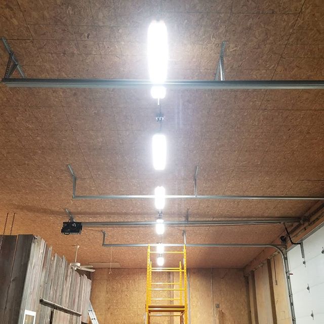 Replacing old 8' florescent lights with new LED lights.  Only have four to go....#shop #workshop #diy #electical #lights #workshoplighting #ledlights